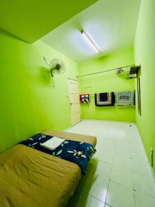 Postel nebo postele na pokoji v ubytování Jizek Homestay Bajet
