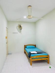 Postel nebo postele na pokoji v ubytování Jizek Homestay Bajet