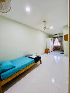Postel nebo postele na pokoji v ubytování Jizek Homestay Bajet