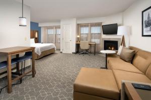 a hotel room with a couch and a bed at Residence Inn Denver South/Park Meadows Mall in Centennial