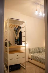 a bedroom with a dresser and a bed in a room at Sa Roca in Campionna +13 photos