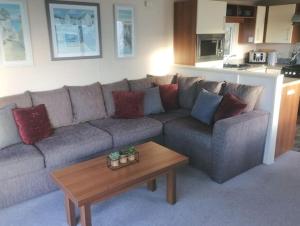 a living room with a couch and a coffee table at Parkview, Port Haverigg in Haverigg