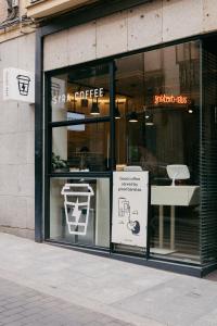 a store window with a sign in front of it at Select Sol in Madrid