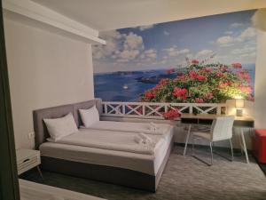 a room with a bed and a painting on the wall at Art's Luxury Boutique Hotel in Oradea