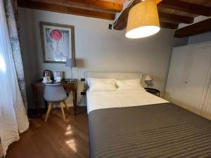 Postel nebo postele na pokoji v ubytování Le Camere di Bsuites Affittacamere