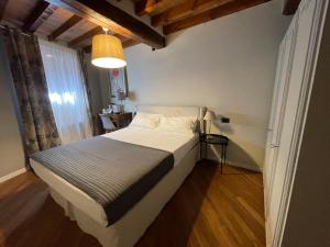 Postel nebo postele na pokoji v ubytování Le Camere di Bsuites Affittacamere
