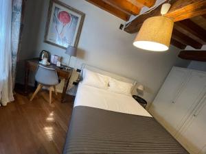 Postel nebo postele na pokoji v ubytování Le Camere di Bsuites Affittacamere