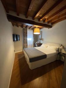 Postel nebo postele na pokoji v ubytování Le Camere di Bsuites Affittacamere + 36 fotografií