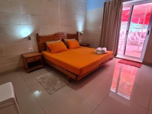 Llit o llits en una habitació de Sensi Hotel
