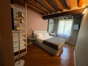 Postel nebo postele na pokoji v ubytování Le Camere di Bsuites Affittacamere