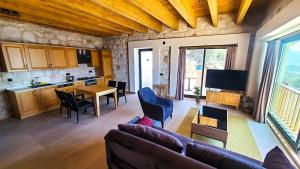 a living room with a couch and a table at Kaleli Deluxe Homes in Kas