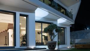a house with a potted plant in a vase at Villa Pacifica Nador in Nador