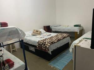 Postel nebo postele na pokoji v ubytování Pousada Recanto dos Leporage