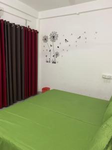 Postel nebo postele na pokoji v ubytování Beach Guest House Addalaichenai
