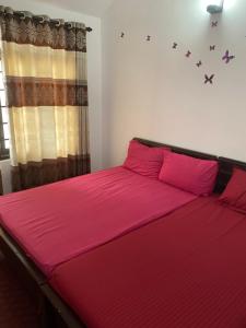 Postel nebo postele na pokoji v ubytování Beach Guest House Addalaichenai