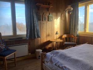 Postel nebo postele na pokoji v ubytování Pasvik Taiga