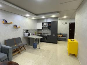 Kuchyň nebo kuchyňský kout v ubytování Islane Appart Hotel