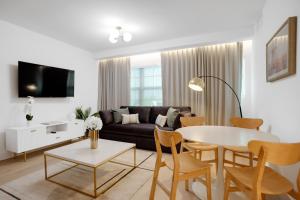 a living room with a couch and a table at Vonder Miami Beach - Unit 6 in Miami Beach +16 photos