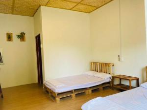 Postel nebo postele na pokoji v ubytování Homestay Dat Phu