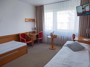 Postel nebo postele na pokoji v ubytování Hotel ILF