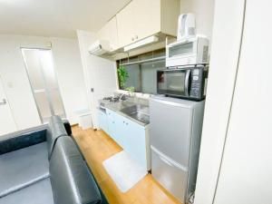 新大阪駅近く A1 Guest House ユニオン新大阪,リーズナブルで長期滞在にも最適にあるキッチンまたは簡易キッチン