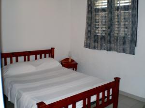 מיטה או מיטות בחדר ב-Abri Gens Libres