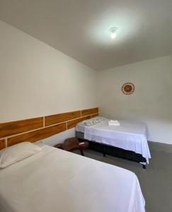 Postel nebo postele na pokoji v ubytování Pousada Cantinho de Milagres + 4 fotografie