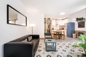 a living room with a couch and a table at GuestReady - Serene Hideout in Downtown in Porto