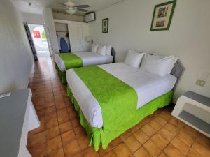 Voodi või voodid majutusasutuse Jolly Beach Antigua - All Inclusive toas