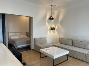 Ένα ή περισσότερα κρεβάτια σε δωμάτιο στο Metro apartment