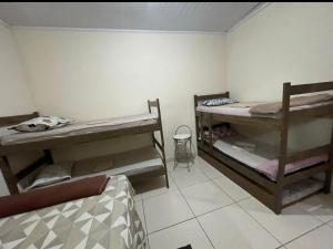 a room with two bunk beds in a room at Jockey Apto 2 in Campos dos Goytacazes