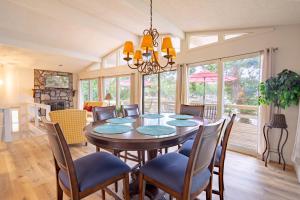 a dining room with a table and chairs at Vacation Home Mallard Water Front two king beds in Lake Ozark