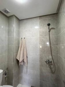 a bathroom with a shower and a toilet at Nour Beach Cabo in Martil