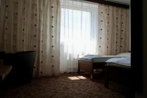 Ένα ή περισσότερα κρεβάτια σε δωμάτιο στο Hotel Merkur - Jablonec nad Nisou