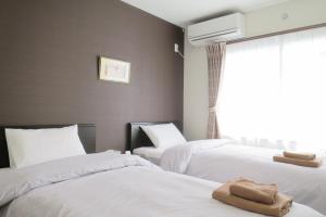 Postel nebo postele na pokoji v ubytování Hotel Imalle Haneda + 18 fotografií