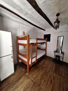 Ein Bett oder Betten in einem Zimmer der Unterkunft Intro Hostels Cusco