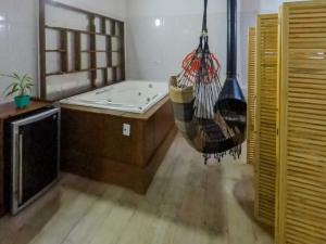 a room with a hammock hanging in a room at Casa do sol in Sao Paulo +32 photos