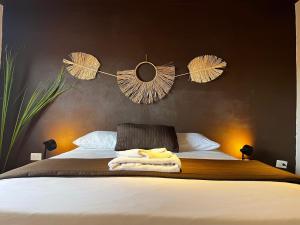 a bedroom with a bed with fourwheels on it at MOKA HOUSE in Santo Domingo