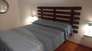 Ένα ή περισσότερα κρεβάτια σε δωμάτιο στο La casa dei Nani