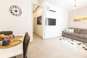 a living room with a table and a couch at MagicFlo Santa Croce Appartamento in Florence