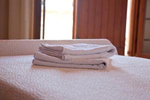 A bed or beds in a room at Tsivaras Villas