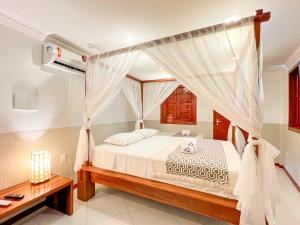 Rúm í herbergi á Mini Hotel Dunas