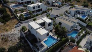 an aerial view of a house with a swimming pool at Villa Night Pearl in Trogir +10 photos
