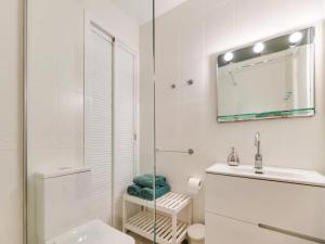 a bathroom with a shower and a toilet and a sink at Spacious 3BR Walk to Beach & Old Town Marbella in Marbella +18 photos