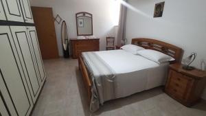 Postel nebo postele na pokoji v ubytování CasaMaPiè Binetto