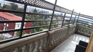 een balkon met uitzicht op een stad bij Jacar Hotel in Addis Ababa