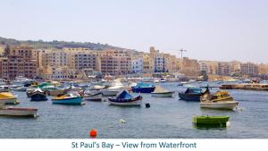 a bunch of boats in the water in a harbor at Ta' Pace, Holiday Apartment in St Paul's Bay +19 photos