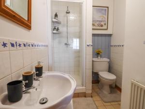 a bathroom with a sink and a toilet at The View in Faversham