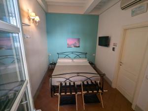 Postel nebo postele na pokoji v ubytování BonConvento Guesthouse - HiTuscany
