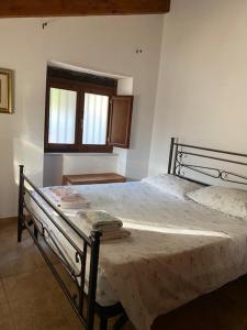 a bedroom with a bed in a room at Casale del Principe Itri in Itri +12 photos